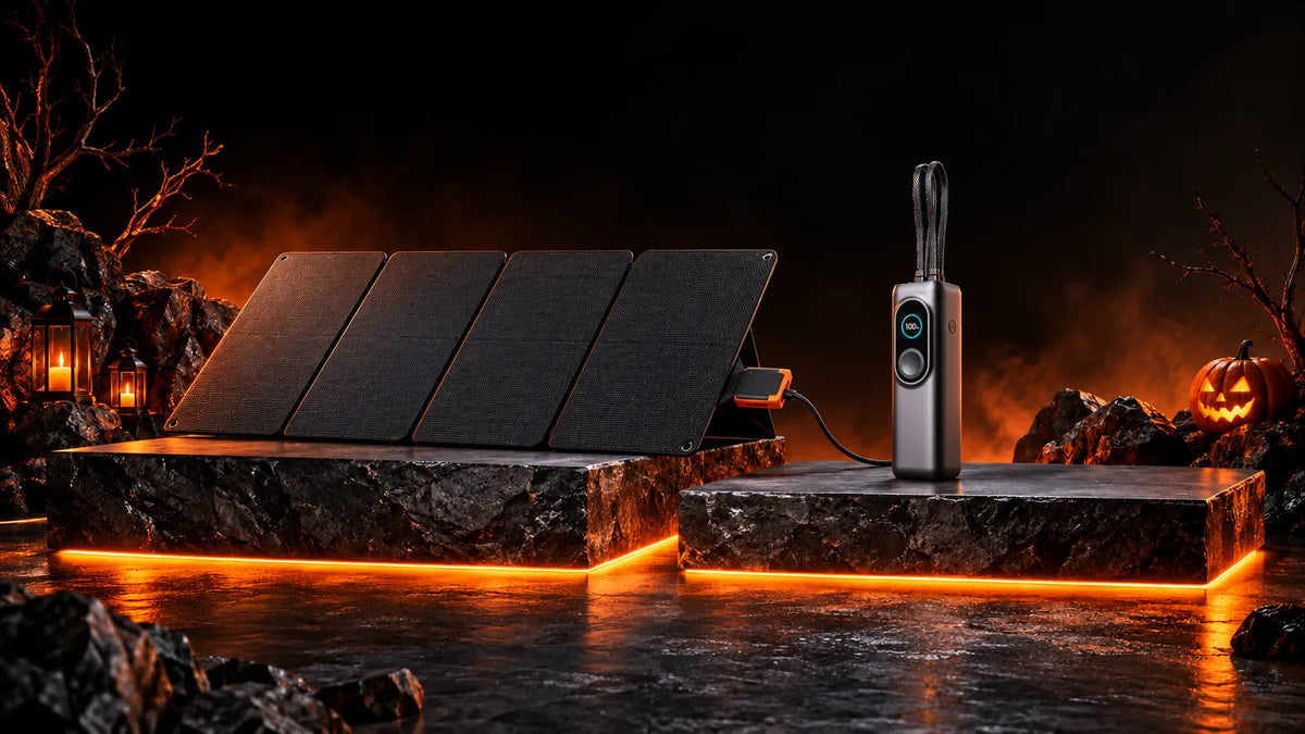 Halloween solar charging setup with a portable power bank and folding solar panel