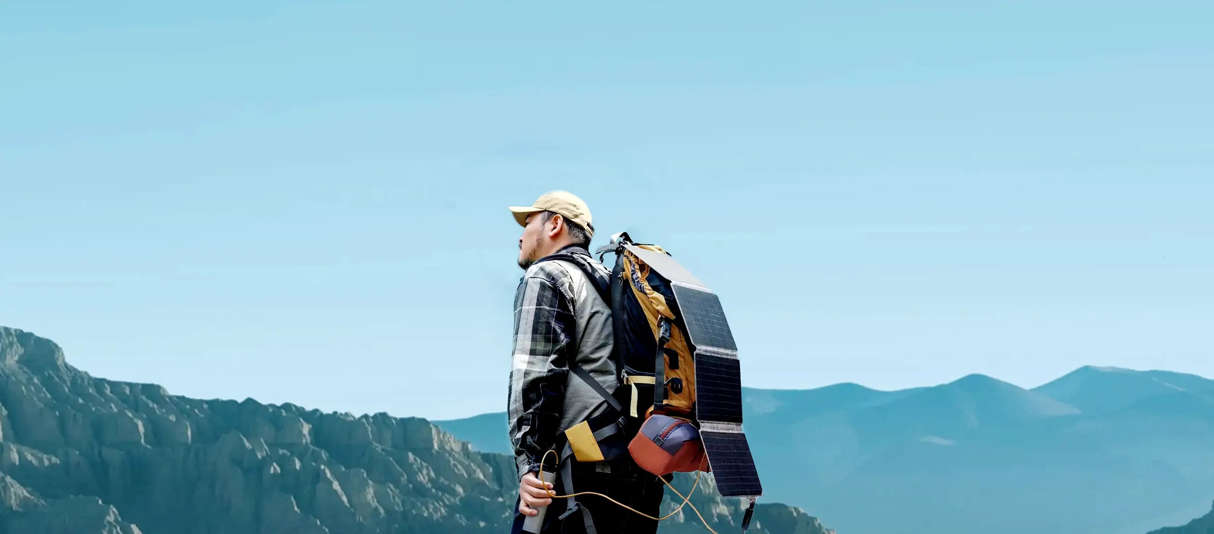 iFORWAY 36W portable solar panel charger deployed on the grass in a natural setting. It captures sun energy using efficient panels to provide charging for a connected phone and power bank, enabling Power On the Go. Featuring stable performance, Built Tough engineering, and IP67 waterproof rating, this ultra-compact foldable solar charger ensures off-grid power freedom for hikers and backpackers who need reliable energy far from outlets.