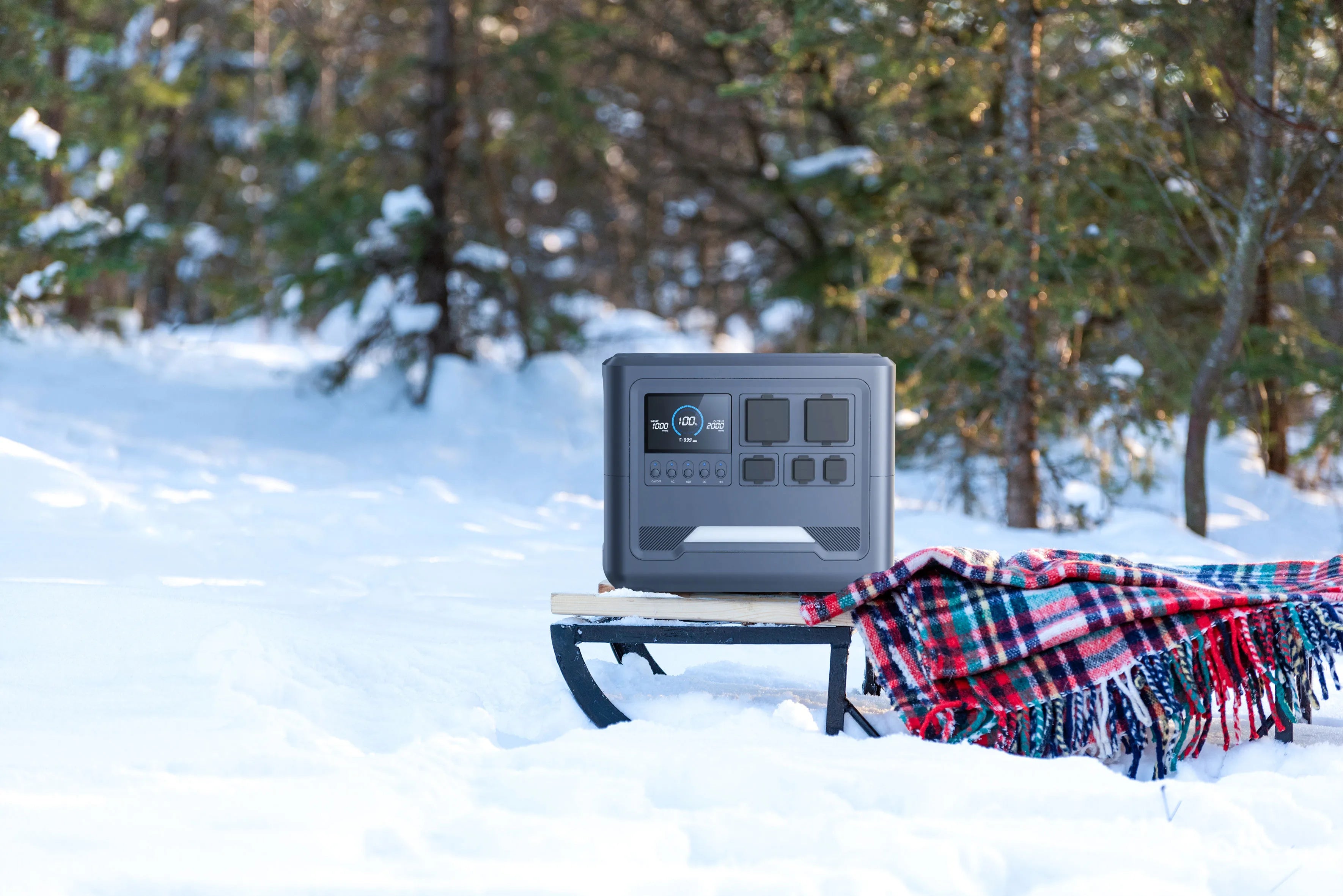 iFORWAY high-capacity power station showcased in a snowy winter forest. Engineered to withstand extreme cold, it ensures stable performance and reliable energy delivery for winter camping and snow adventures. Featuring superior safety protocols and a Built Tough exterior, it maintains high power output when you need it most. An essential hub for off-grid living in harsh climates, providing Power On the Go for heaters and gadgets even in freezing temperatures.